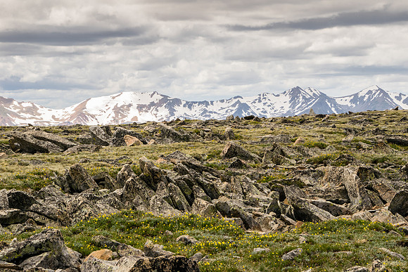 Rock formations in front of mountains